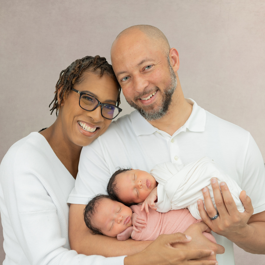 Portrait of a Family with one young daughter and one newborn baby girl