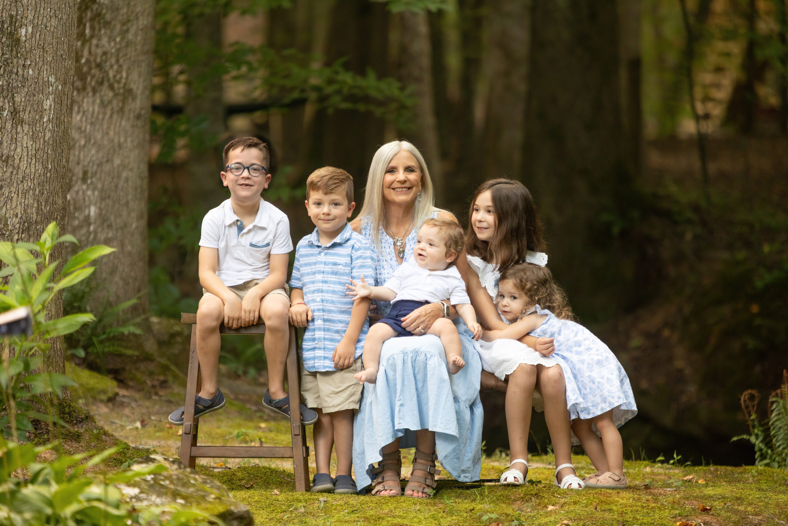 Family of five children with their Grandma in an outdoor photo session in Cumming Georgia