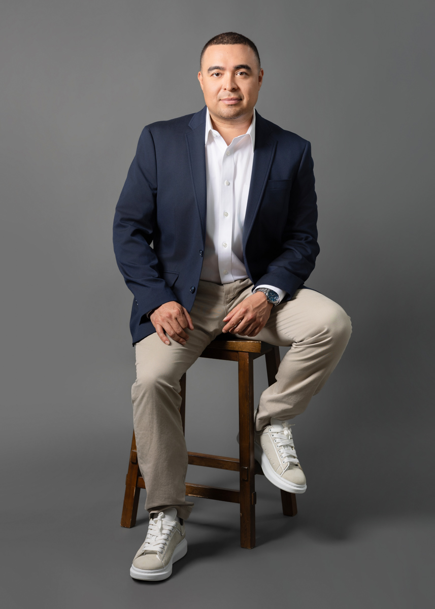 hands posed in lap with wrists crossed